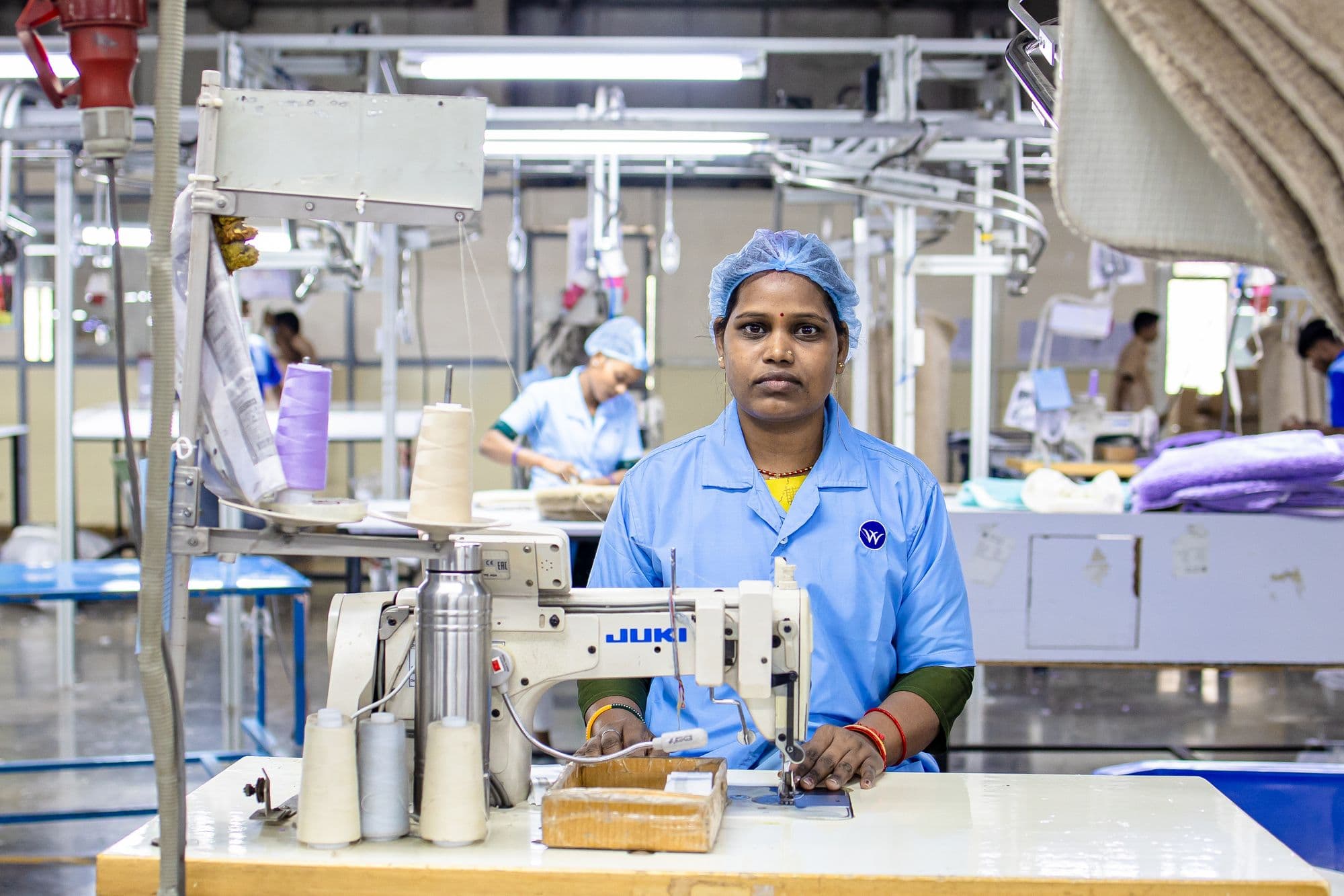 A machine operator at her station in a garment factory